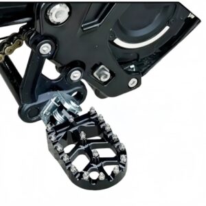 Black CNC wide foot pegs installed on Sur-Ron Light Bee close-up